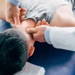 Dr. Robinson: Voted Best Patient Care for Chiropractors in Southeast Louisiana 2026 6 Chiropractor working on a man's neck
