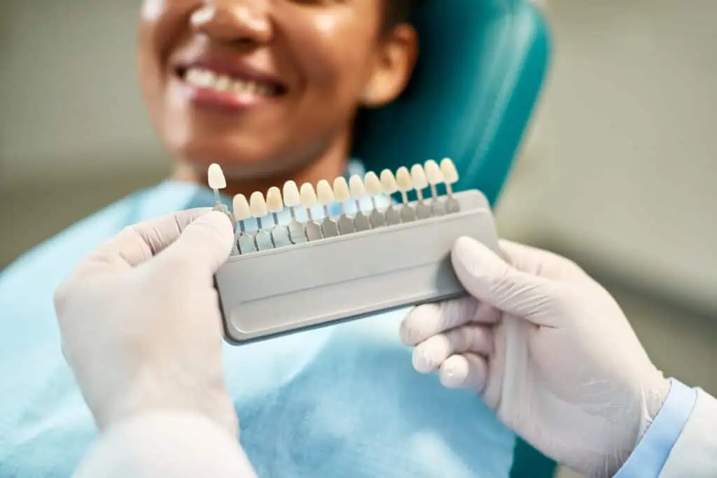 Dentist Matches a Crown to Existing Teeth