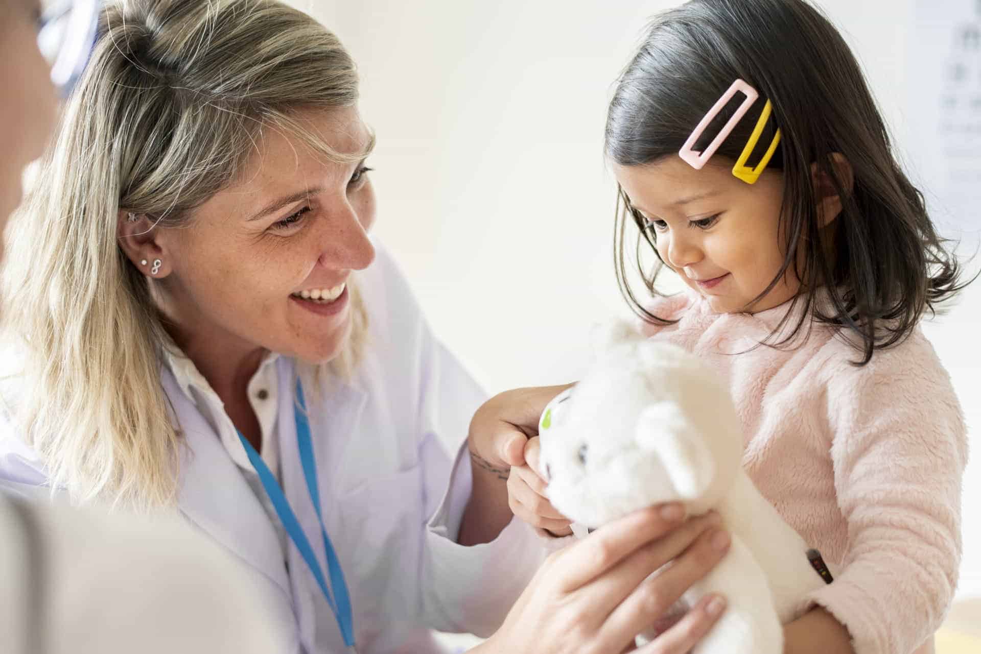 Pediatrician with patient