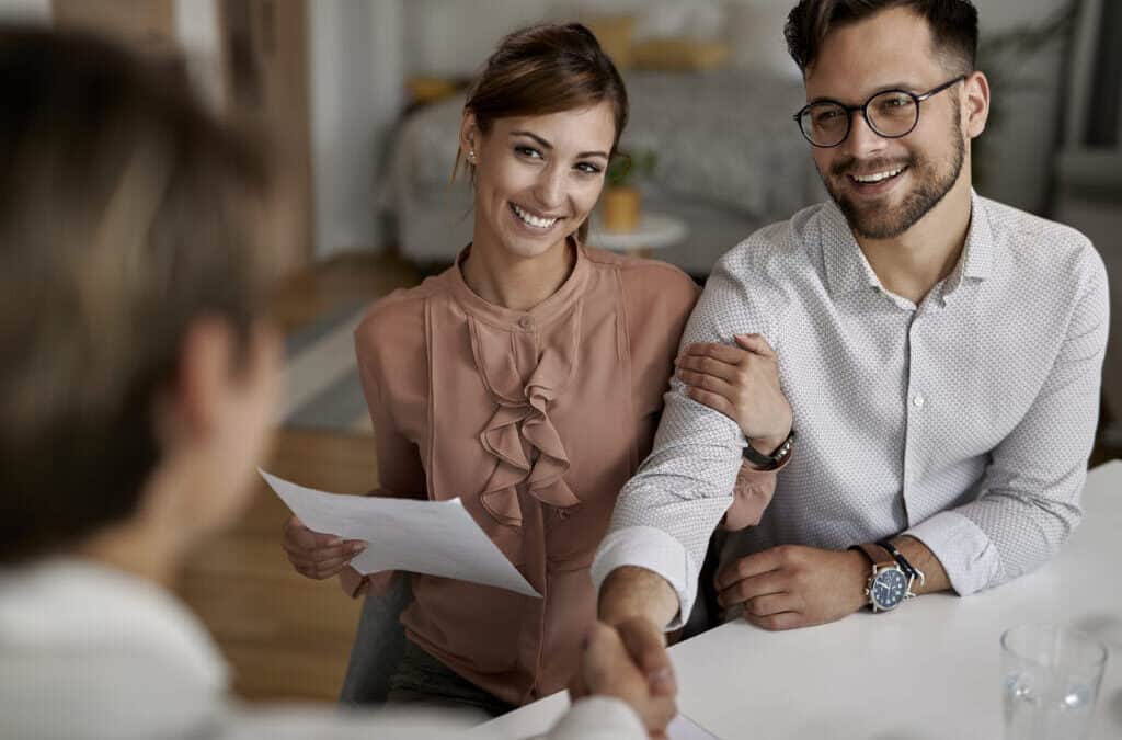 couple thanking insurance advisor