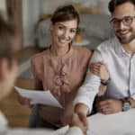 couple thanking insurance advisor