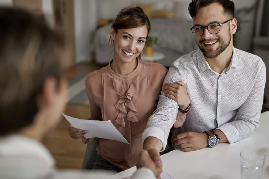 couple thanking insurance advisor