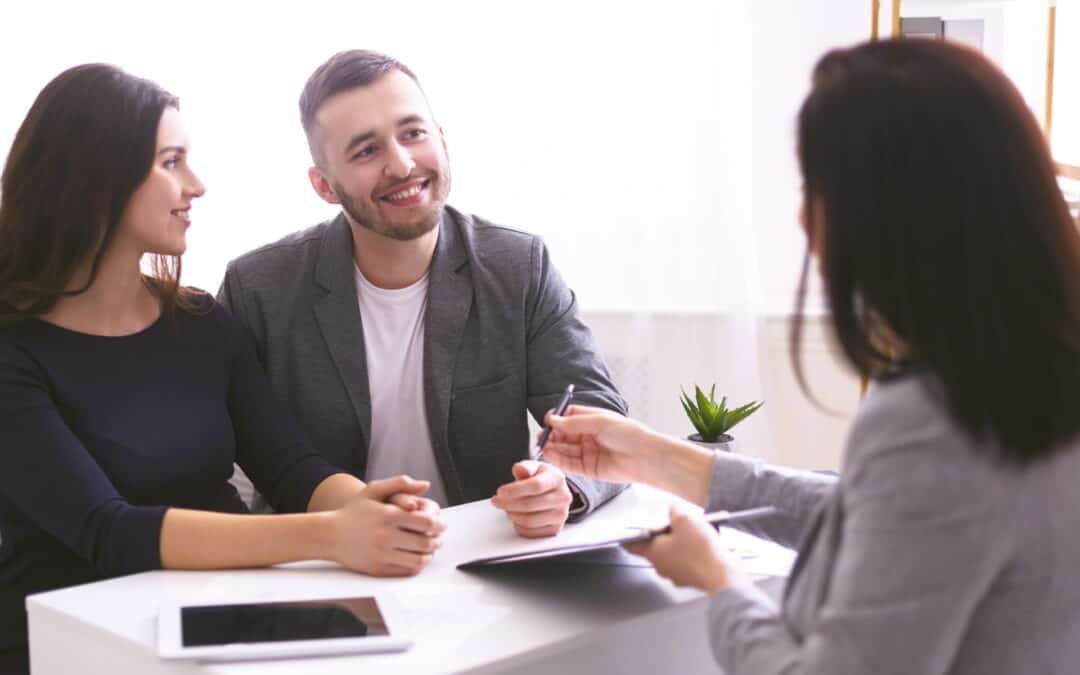 young-couple-listening-to-insurance-advisor
