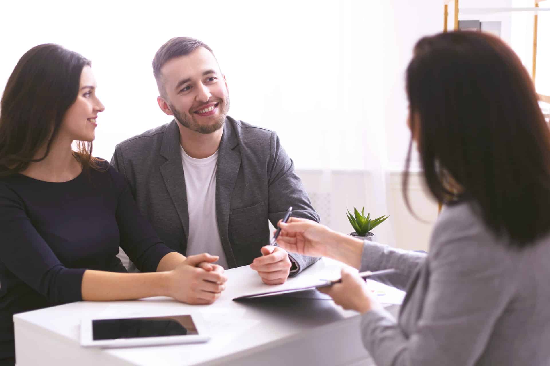 young-couple-listening-to-insurance-advisor