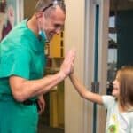 Dr. Jason Parker: Voted Best Patient Care for Pediatric Dentists in Louisiana 2026 6 pediatric dentist with little girl