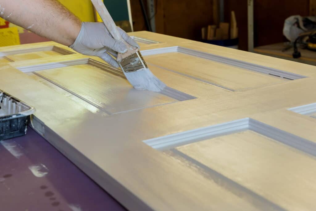 Ponderosa Painting: Voted Best Customer Service for Painters in Louisiana 2026 1 Painting a door