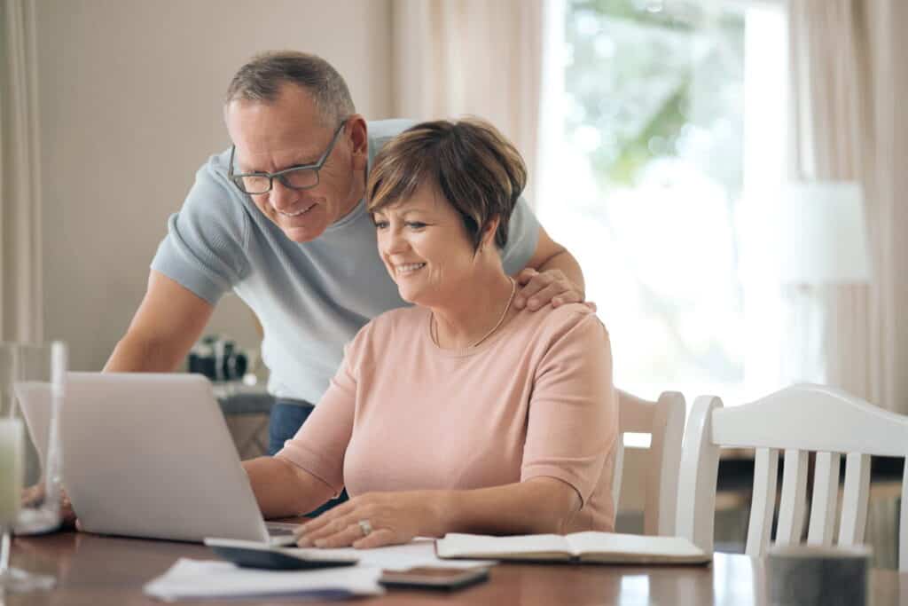10 Reasons Your Homeowners Insurance Rate May Increase 2 elderly couple on the computer